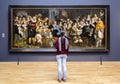 AMSTERDAM, NETHERLANDS - FEBRUARY 08: Visitor at Rijksmuseum on Royalty Free Stock Photo